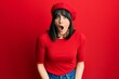 © Krakenimages.com - Young hispanic woman wearing french look with beret afraid and shocked with surprise expression, fear and excited face.