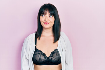 Poster - Young hispanic woman wearing lingerie smiling looking to the side and staring away thinking.