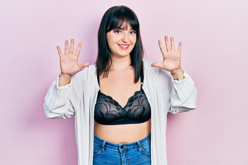 Sticker - Young hispanic woman wearing lingerie showing and pointing up with fingers number ten while smiling confident and happy.