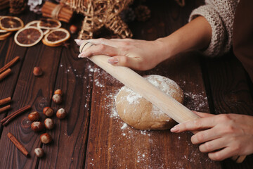 Canvas Print - Woman rolling gingerbread dough with rolling pin