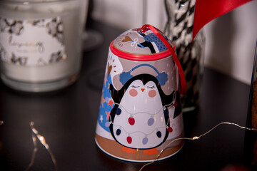 Christmas toy in the form of a penguin among Christmas decorations
