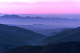 Fototapeta Lawenda - Sunrise in pink colors of the sun in the mountains