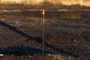 Poster - Vintage bayonet knife in the ground