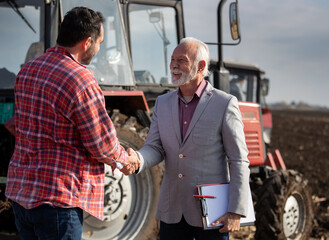 Sticker - Farmer and insurance person shaking hands in field