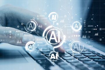 Poster - Close up of hand using laptop with creative AI hologram on blurry background. Artificial intelligence, ai, technology and communication concept. Double exposure.