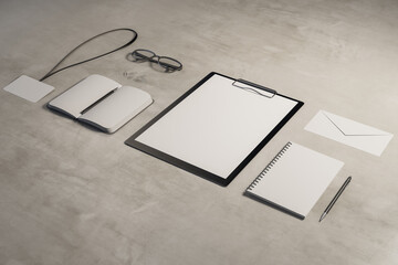 Wall Mural - Top view and close up of empty office supplies on concrete desk. Clipboard, notepad, bad, envelope. Mock up, 3D Rendering.