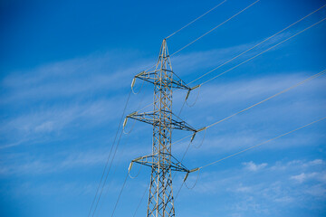 electrical distribution tower on blue sky