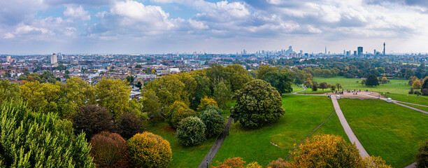 Wall Mural - Beautiful aerial view of London with many green parks and city skyscrapers in the foreground.