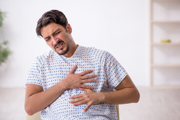 Young male patient waiting for doctor at the hospital