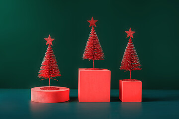 Poster - christmas tree red color with star pine tree group on green background with space