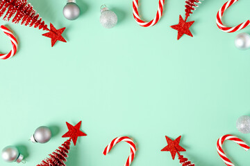 Poster - top view christmas ornament xmas tree,candy cane,bauble decor on pastel green background