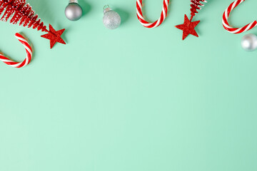Poster - top view christmas ornament xmas tree,candy cane,bauble decor on pastel green background