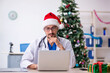 © Elnur - Young male doctor celebrating Christmas at the hospital