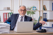 © Elnur - Old male employee and too much work in the office