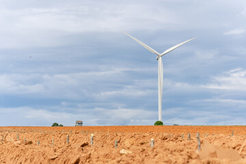 Wall Mural - Wind turbines of global ecology with cloud background on the sky. alternative electricity source to be sustainable resources in the future. Clean energy concept saves the world