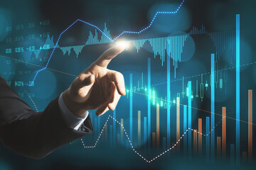 Wall Mural - Close up of businessman hand pointing at creative glowing forex graph on blurry bokeh background. Market analysis and trade concept. Double exposure.