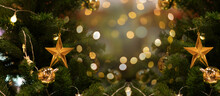 Focus On The Christmas Tree Star Lights And Bokeh Near The Christmas Fireplace.