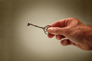 hand holding old vintage key