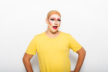 Surprised Man With Drag Queen's Make-up On Face In Front Of White Background