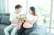 © u photostock - portrait asia young pregnant woman and husband happy together on sofa