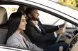 © New Africa - Young woman and driver in modern car