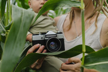 Mother With Toddler Holding Vintage Camera
