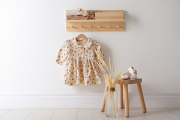 Wall Mural - Cute children's clothes and shoes in room