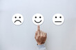© Sai - Circle paper with sad face icon normal face icon and smiley face icon. Customer Service Satisfaction Concept