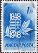 HUNGARY - CIRCA 1948: A post stamp printed in Hungary showing the National Coat of Arms of Hungary. blue.