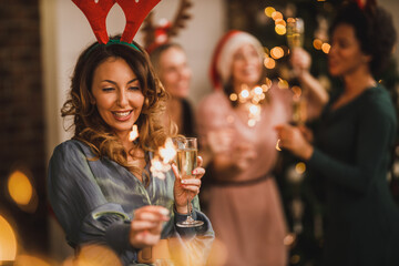 Wall Mural - Woman Having Fun During Gathering At Home To Celebrate New Year With Friends