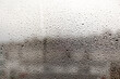 © EleniaPhoto - Raindrops on glass on a blurred background. Rain on the window. Dripping rain on the window. Texture. Photo