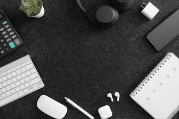 Poster - top view of office desk table with  calculator, notebook, plastic plant, smartphone and keyboard.