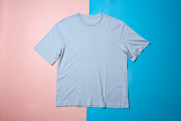 Wall Mural - Blue t-shirt mockup on colorful background. Flat lay tee template