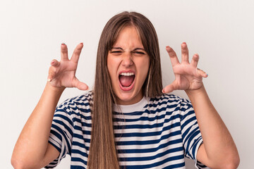 Wall Mural - Young caucasian woman isolated on white background showing claws imitating a cat, aggressive gesture.