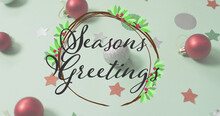 Image Of Seasons Greetings Text Over Christmas Decorations