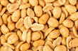 Salted peanuts as a background closeup, top view, flat lay