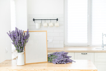 Wall Mural - A bouquet of lavender in the interior of a stylish kitchen. Vertical frame mockup on a wooden table.