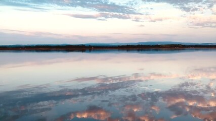Wall Mural - Clouds reflection on calm water surface. Beautiful view over Ria de Aveiro - Portugal.
