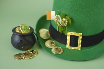 Saint Patrick background.Green leprechaun hat, flag,gold coins. Irish traditional spring holiday.Saint Patrick background.St.Patrick 's Day