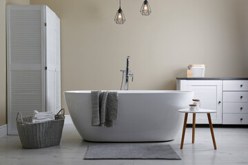 Wall Mural - Soft grey mat on floor near tub in bathroom. Interior design