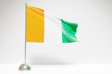 Wall Mural - 3D illustration of the national flag of Cote d'ivoire on a metal flagpole fluttering .Country symbol.