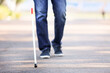 © Pixel-Shot - Blind man with walking stick outdoors