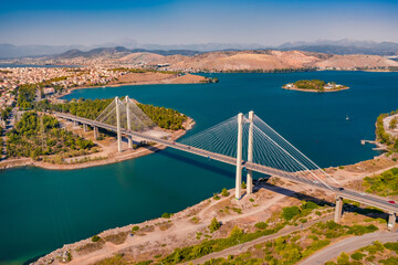 Splendid summer view of High Bridge Evripos. Amazing morning cityscape of Chalcis town, Greece. Bright seascape of Aegean sea, North Euboean Gulf. Traveling concept background..