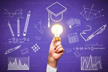 Wall Mural - Close up of hand holding light bulb with creative knowledge and graduation sketch on purple wall background. Education, idea and academic concept.