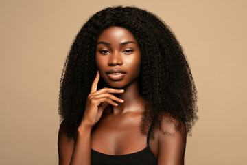 Wall Mural - overthinking. beauty fashion portrait of young beautiful african american woman with volume,curly ha