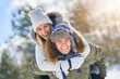 © Kalim - Couple having fun in winter scenery and snow