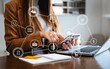 © Nuttapong punna - Woman hand using tablet ,laptop, and holding mobile with credit card online banking payment shopping