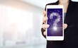 © Alexa Mat - FAQ Concept image.Find answer online. Hand hold white smartphone with digital hologram question mark sign on light blurred background. Business support concept. Problems and solutions.