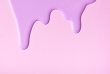 Light Lilac Liquid Drops Of Paint Color Flow Down On Pink Background. Abstract Purple Backdrop With Fluid Drip Pattern.