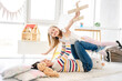 © Ievgen Skrypko - Happy girl with pretty mother playing in kids room
